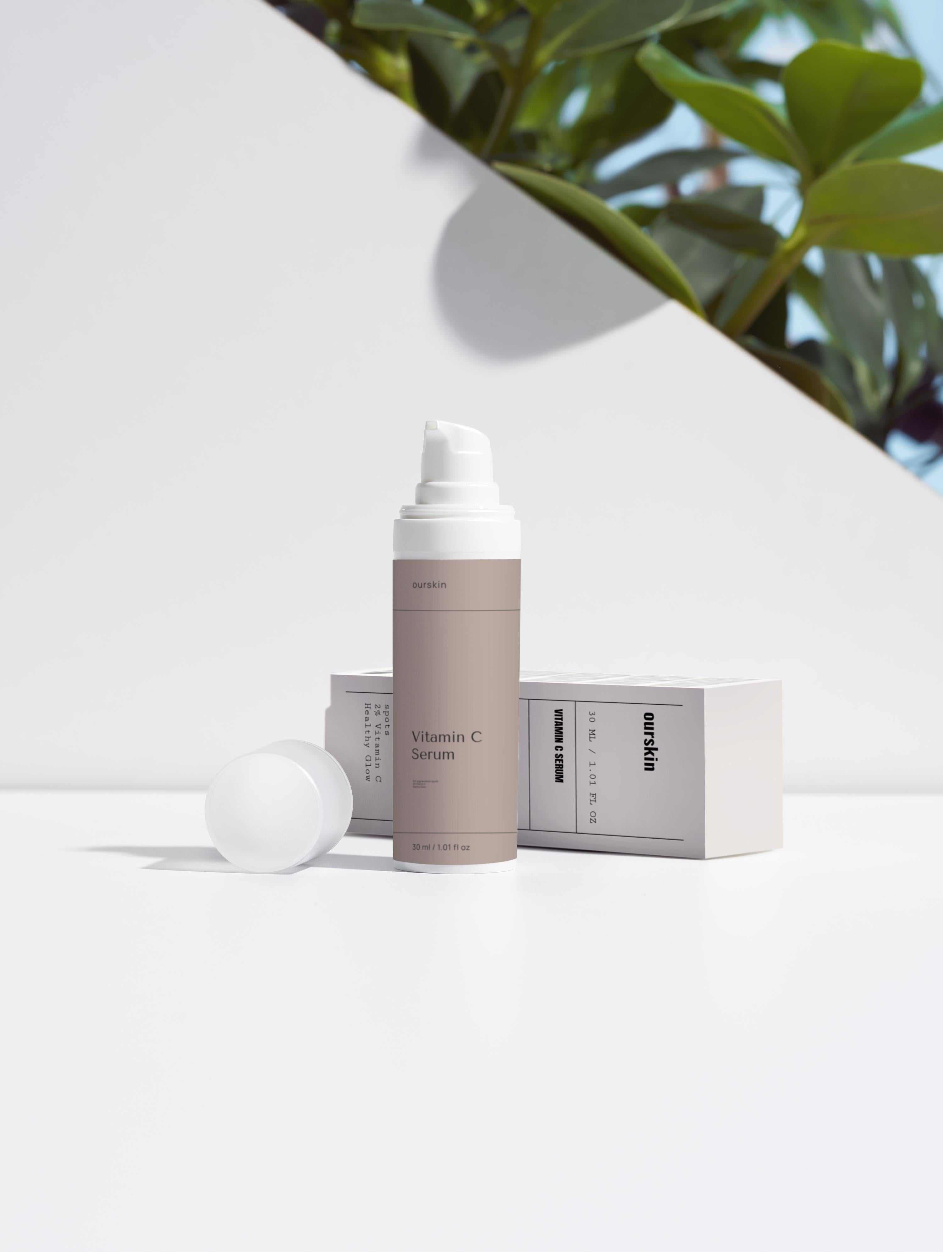 Vitamin C serum bottle with 2% natural vitamin C, ferulic acid, and sea buckthorn oil for brightening and hydrating skin